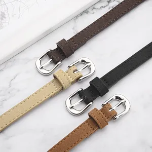 Minimalist women's thin suede belt set with silver metal buckle, stylish jeans dress accessory.