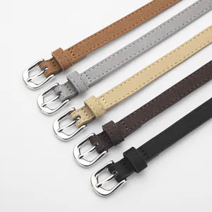Minimalist women's thin suede belt with silver metal buckle, multi-color main product shot