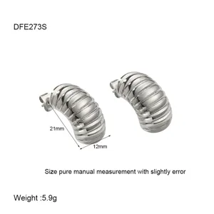 Detail shot of silver striped dome stud earrings, 21mm size and weight display.
