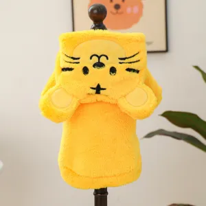 Yellow plush pet clothing detail showing cute animal face and paw design for small dogs.
