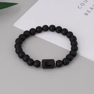 Schwarzes mattes Perlenarmband mit Sternzeichen und goldenen Abstandshaltern für Paare Schmuck.