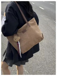 Stylish large capacity corduroy tote bag for women commuting casual daily shoulder bag.