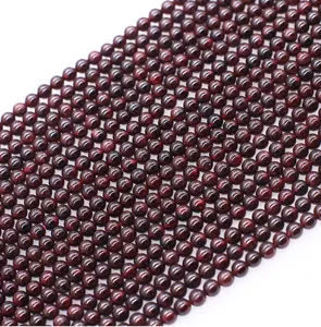 Garnet gemstone beads detail, dark red crystal loose beads for DIY handmade bracelets.