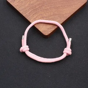 Handmade woven pink adjustable Milan rope bracelet detail view for minimalist style couples.