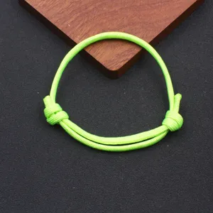 Fluorescent green paracord bracelet detail shot, adjustable handmade rope accessory
