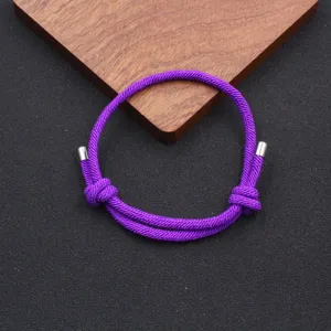 Handmade purple woven adjustable rope bracelet, simple minimalist design for daily wear.