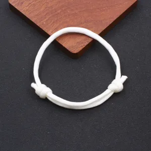 White color paracord adjustable braided bracelet nylon handmade wristband fine detail view.