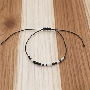 Minimalist Morse code bracelet with black and white seed beads, adjustable braided cord for couples.