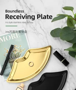 Stainless steel lip-shaped jewelry tray, aesthetic gold desktop organizer for cosmetic and small accessories.
