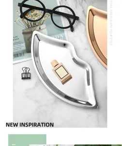Detailed view of the stylish stainless steel lip-shaped jewelry tray, modern vanity organizer.