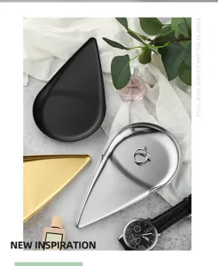 Detail view of Nordic stainless steel teardrop jewelry tray, elegant metal desktop cosmetic storage.