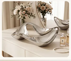 Detailed shot of the modern fluid curve metal tray showcasing its sleek aesthetic and finish.