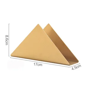 Gold triangular stainless steel napkin holder, modern tabletop tissue dispenser for restaurant.
