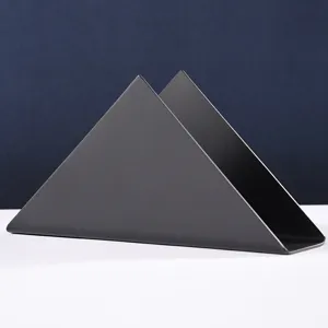 Modern minimalist black triangular metal napkin holder for restaurant and home table.