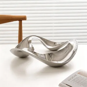Nordic modern curved stainless steel decorative tray, elegant abstract tabletop storage organizer.