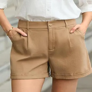 Khaki high-waist pleated casual shorts detail, cuffed hem, comfortable daily wear style.