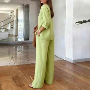 Lime green linen blend casual two-piece suit with V-neck top and wide-leg pants.