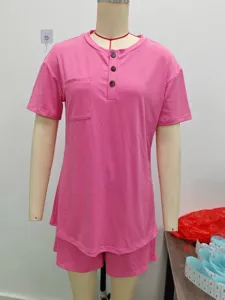 Pink ribbed short sleeve top and shorts set detail view, casual comfortable daily summer wear.