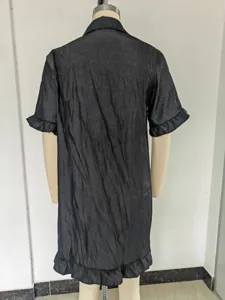 Back view detail of the black short sleeve ruffle hem casual loose mini dress texture.