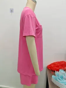 Pink short sleeve top and shorts set detail view, casual ribbed two-piece outfit style.