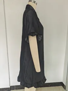 Black loose shirt dress featuring stylish ruffle sleeves and hem, perfect for summer chic.