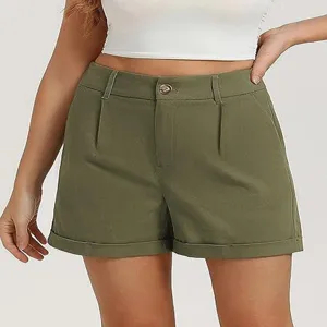 High-waisted olive green casual shorts detail, showing rolled cuffs and button closure.