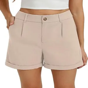 Detailed view of women's high waisted casual shorts featuring pleated design and cuffed hem.