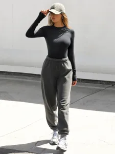 Ribbed crewneck long-sleeve detail view, solid color slim fit basic top for women layer.