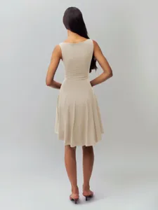 Detail view of the back and sleeveless design of the solid color slim dress.