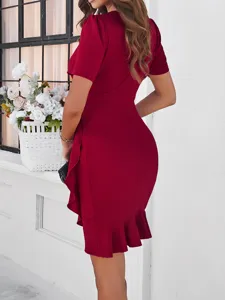 Wine red bodycon dress detail showcasing the elegant ruffle hem and fitted silhouette.