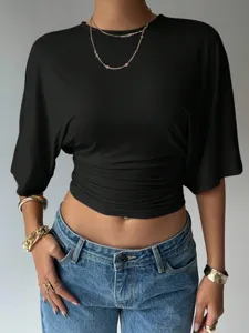 Detailed view of the black short sleeve ruched waist crop top showcasing stylish fit.
