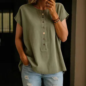 Women's casual solid color short sleeve blouse with button front detail and comfortable fabric.