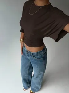 Close-up of the stylish brown slim-fit short sleeve top with flattering ruched waist design.