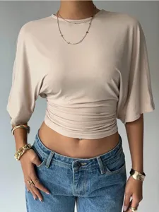 Chic beige crewneck crop top with waist-cinching ruched design, perfect for summer wear.
