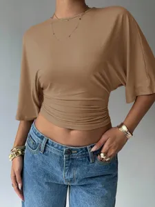 Detailed view of the stylish khaki crop top featuring a flattering waist and short sleeves.