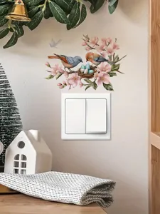 Detailed view of decorative wall switch sticker featuring cute birds and pink flowers design.