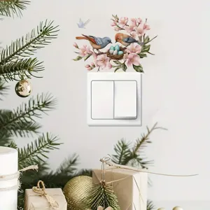 Decorative switch sticker featuring cute birds, nest and floral branch design for wall decor.