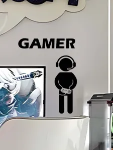Adesivo murale con silhouette di giocatore nero con cuffie e controller per stanza.