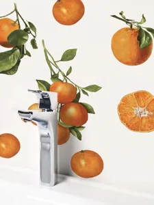 Close-up detail of watercolor orange wall sticker, peel and stick PVC home decor decal.