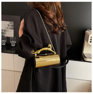 Exquisite gold acrylic evening shoulder bag with chic leopard handle and chain strap for women.