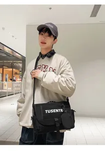 Elegante bolso mensajero negro de lona para hombre, estilo casual con detalles practicos.