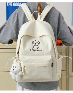 White canvas student backpack with cute dog embroidery design and plush pendant, large capacity.