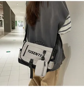 Elegante bolso bandolera de lona casual con pequeño estuche, diseño resistente para uso diario.
