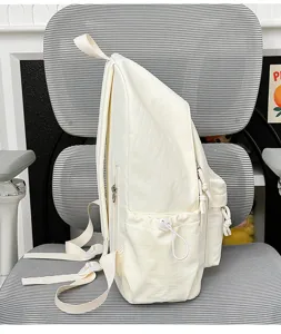 Casual white school backpack with large capacity, side pockets and adjustable straps for daily use.