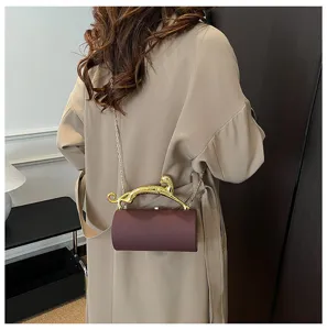Elegant cylindrical evening shoulder bag with luxury gold leopard handle for women stylish.