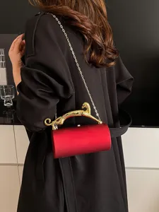Elegant red cylinder evening bag with gold leopard handle and chain strap for women.