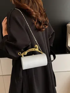 Exquisite white acrylic cylindrical evening bag with gold leopard handle and chain strap.