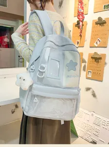Japanese Harajuku style large capacity student school backpack with cute star pendant.