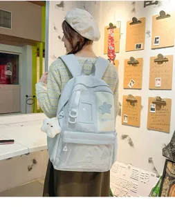 Japanese style large capacity student backpack with star patch and transparent front pocket.