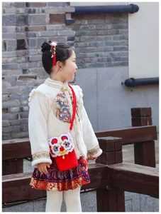 Children winter Chinese style jacket set with cute crochet lion dance cross-body phone bag.